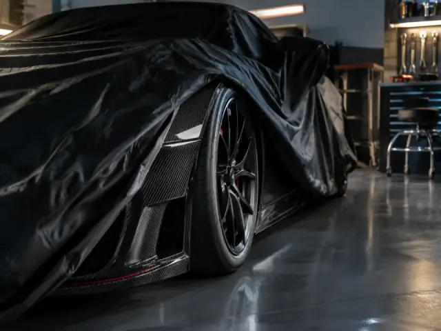 Partly covered compact sports car
